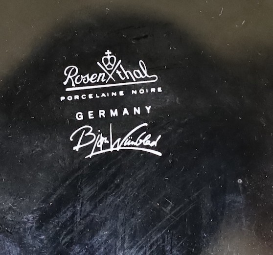 Bjorn Winblad for Rosenthal a gilt decorated black ground charger, 32.5cm diameter